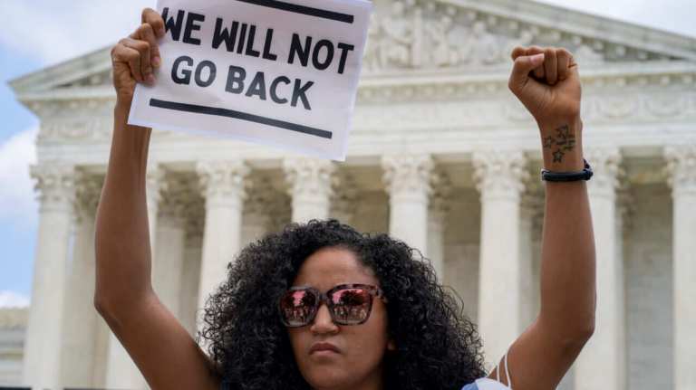 Scotney Young protests outside the U.S. Supreme Court