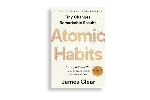 Atomic Habits cover showcasing the title in brown over a white background and James Clear as the author.