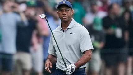 Tiger Woods says he ruptured his Achilles tendon, an injury that will keep him out of the Masters