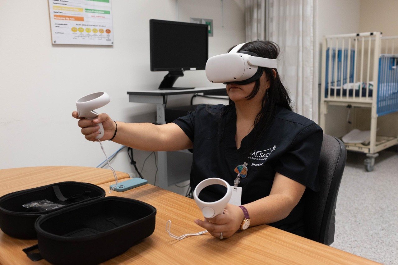 Student Diva Bailey using a virtual reality headset to do a psych evaluation of a simulated patient at Mt. San Antonio College campus. The technology, which is used in many states, allows nursing students to practice diagnosing and treating medical conditions in a low-stakes environment.