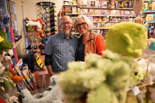 Co-owners Dean Smith, left, and Joanne Farrugia pose for a photograph in JaZams, one of their toy stores Friday, June 27, 2025, in Princeton, N.J. (AP Photo/Matt Slocum)