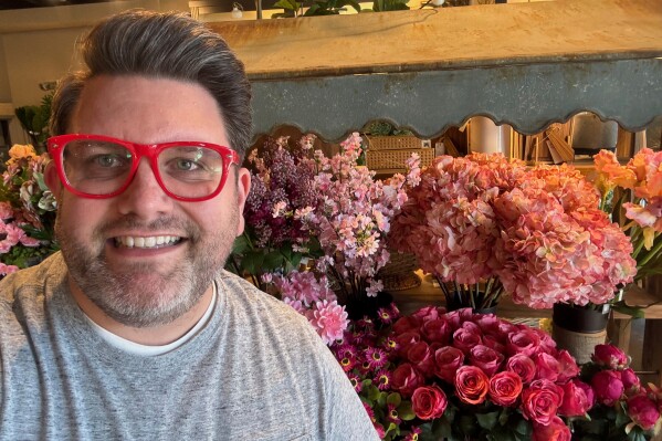 This undated photo provided by Jeremy Rice shows Rice at House, a home-décor shop that specializes in artificial flower arrangements for the home. in Lexington, Ky. (Jeremy Rice via AP)