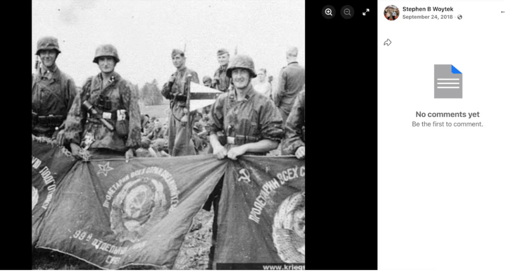 A group of soldiers in military uniforms holding a Soviet flag with the hammer and sickle symbol.