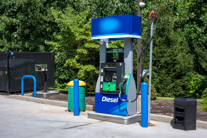 Diesel fuel pump at gas station with digital price display and nozzle