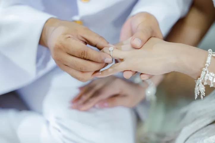 Thai Traditional Wedding Engagement Couple Presenting Their Wedding Rings.