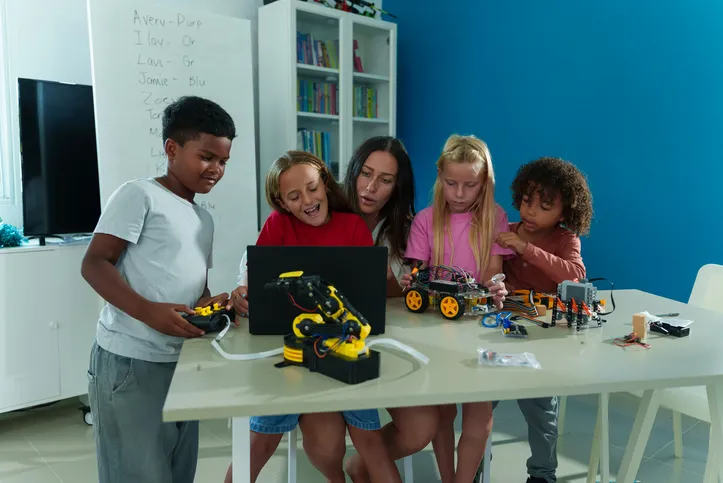 A group of elementary school students are learning to build robots.