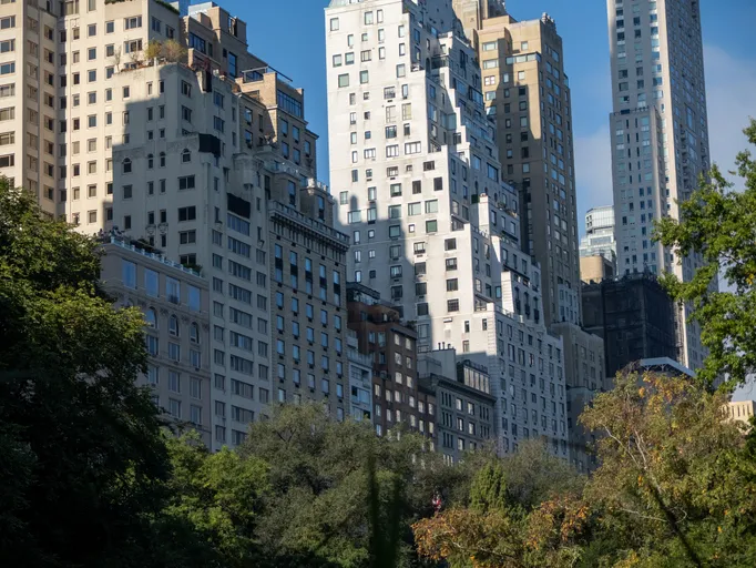 Manhattan skyscrapers rising above Central Park trees in New York City