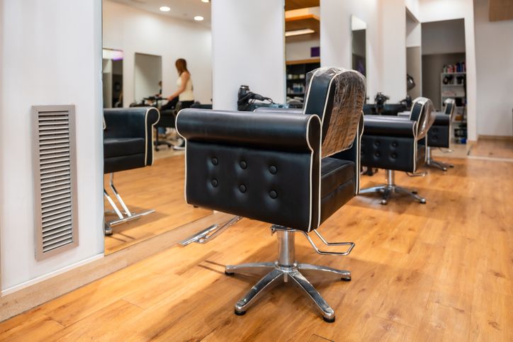 Hair salon interior with styling chairs awaiting clients